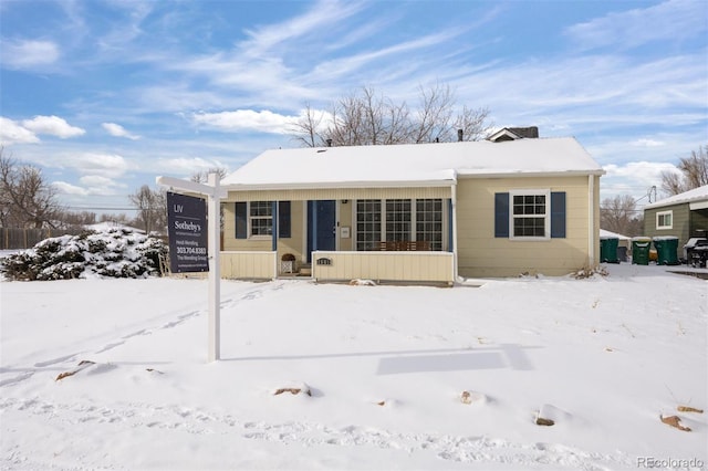 view of snow covered house