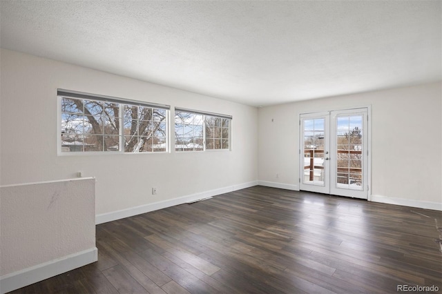 empty room featuring dark hardwood / wood-style flooring