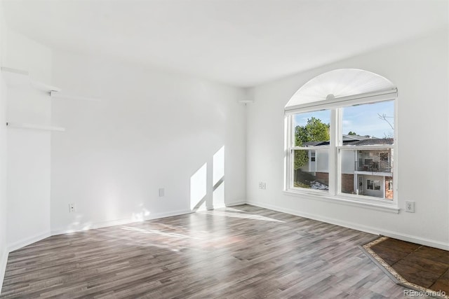 unfurnished room featuring hardwood / wood-style flooring