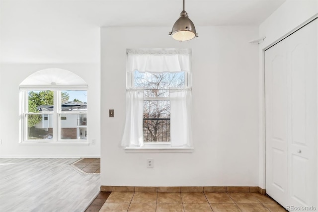 unfurnished dining area featuring hardwood / wood-style flooring