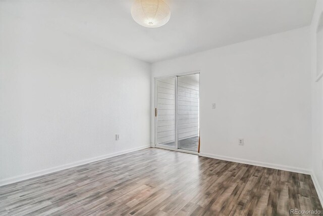 1648 S Cole St Unit B7, Lakewood, CO 80228 - empty room featuring wood finished floors and baseboards