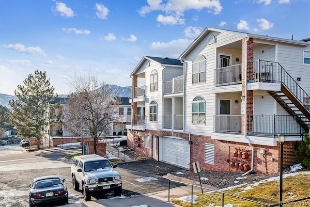 view of front facade featuring a mountain view and a garage