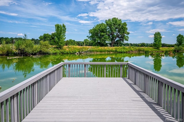 view of dock featuring a deck with water view