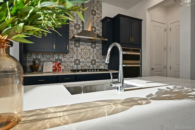 21440 E 61st Dr, Aurora, CO 80019 - kitchen featuring wall chimney exhaust hood, decorative backsplash, double oven, light countertops, and black stovetop