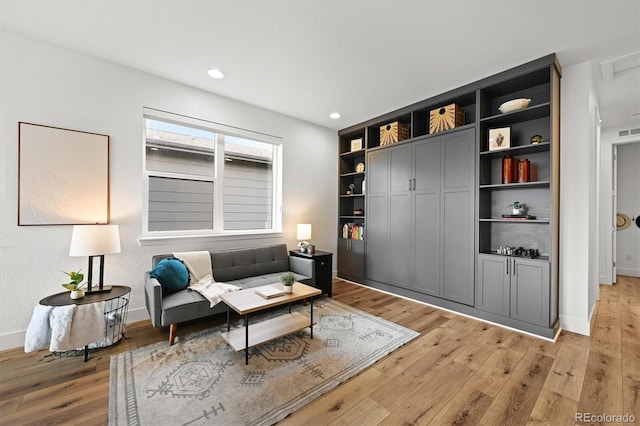 21440 E 61st Dr, Aurora, CO 80019 - sitting room featuring light wood-type flooring, recessed lighting, and baseboards