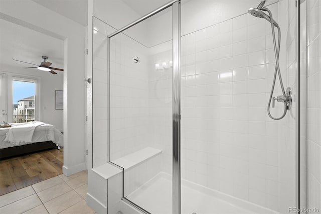 21440 E 61st Dr, Aurora, CO 80019 - ensuite bathroom featuring a stall shower, ceiling fan, and tile patterned flooring