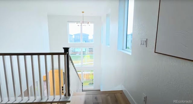 21440 E 61st Dr, Aurora, CO 80019 - stairway with a chandelier