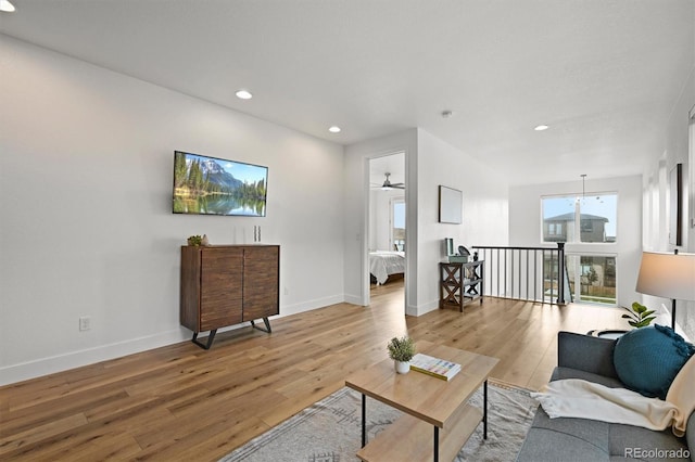 21440 E 61st Dr, Aurora, CO 80019 - living room with recessed lighting, light wood finished floors, and baseboards