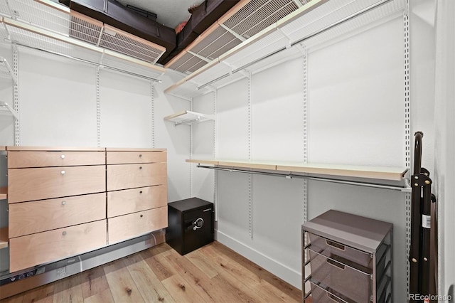 21440 E 61st Dr, Aurora, CO 80019 - spacious closet featuring light wood finished floors