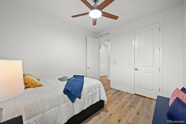 21440 E 61st Dr, Aurora, CO 80019 - bedroom featuring light wood-style floors, a ceiling fan, and baseboards