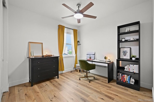21440 E 61st Dr, Aurora, CO 80019 - office area featuring light wood-style flooring, a ceiling fan, and baseboards