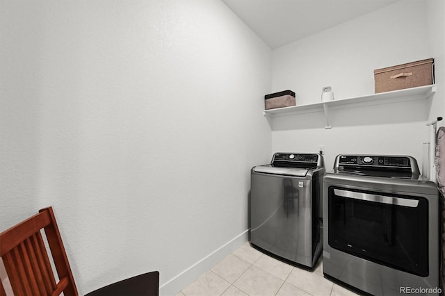 21440 E 61st Dr, Aurora, CO 80019 - laundry area featuring separate washer and dryer, baseboards, and light tile patterned flooring
