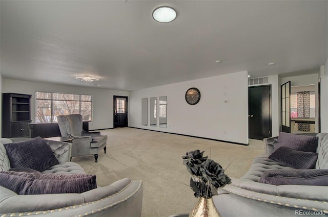 living room featuring light carpet