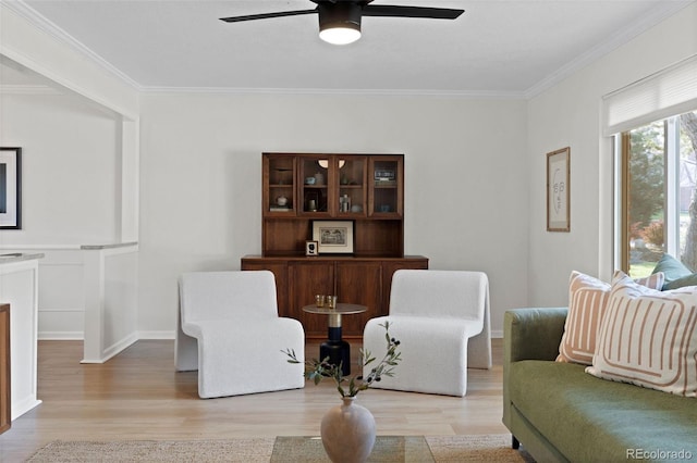 10801 W 29th Ave, Lakewood, CO 80215 - living area with ornamental molding, light wood finished floors, and ceiling fan
