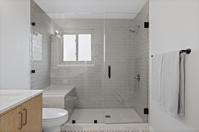 10801 W 29th Ave, Lakewood, CO 80215 - bathroom with vanity, toilet, and a shower stall