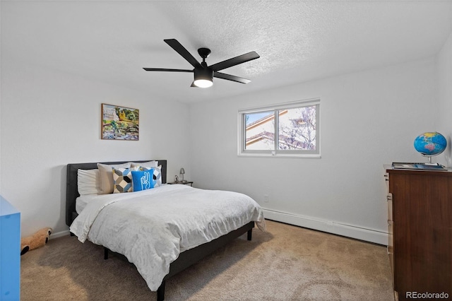 10801 W 29th Ave, Lakewood, CO 80215 - carpeted bedroom with baseboards, a textured ceiling, ceiling fan, and baseboard heating