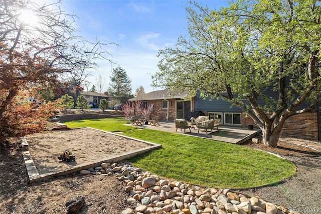 10801 W 29th Ave, Lakewood, CO 80215 - back of house featuring a lawn, a patio area, and brick siding