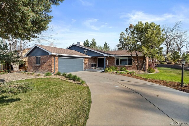 10801 W 29th Ave, Lakewood, CO 80215 - ranch-style home featuring brick siding, a garage, driveway, and a front lawn
