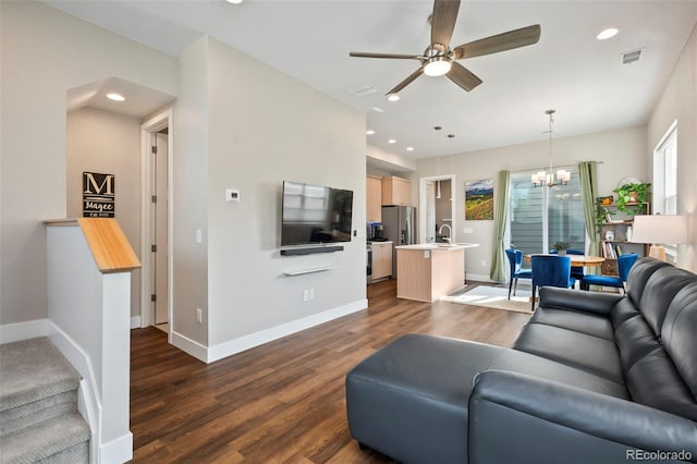 1530 Terry St, Longmont, CO 80501 - living room with a chandelier, ceiling fan, dark wood-style floors, and recessed lighting