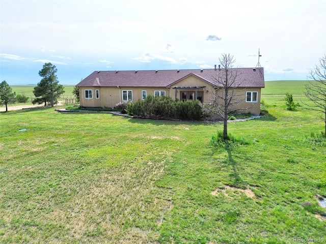1625 N Yoder Rd, Yoder, CO 80864 - rear view of house with a lawn