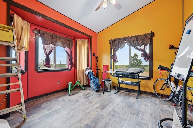 1625 N Yoder Rd, Yoder, CO 80864 - exercise room with vaulted ceiling, a ceiling fan, wood finished floors, and baseboards