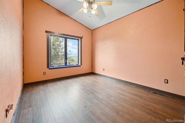 1625 N Yoder Rd, Yoder, CO 80864 - unfurnished room with vaulted ceiling, a ceiling fan, wood finished floors, and baseboards