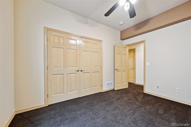 1625 N Yoder Rd, Yoder, CO 80864 - unfurnished bedroom featuring dark colored carpet and ceiling fan