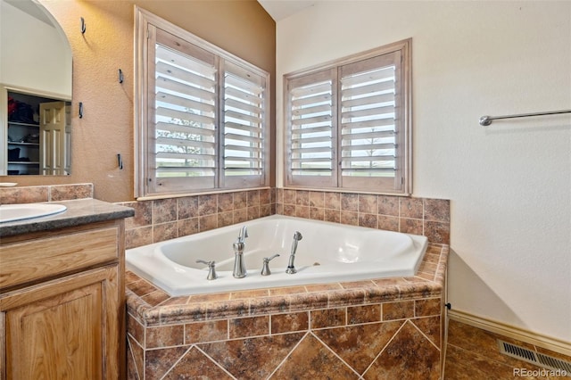 1625 N Yoder Rd, Yoder, CO 80864 - bathroom with a garden tub and vanity