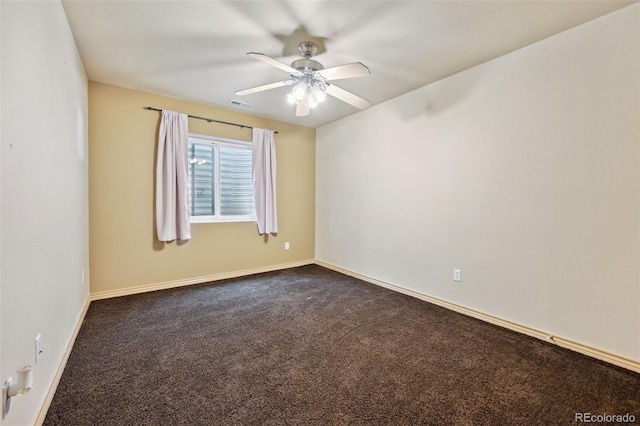 1625 N Yoder Rd, Yoder, CO 80864 - unfurnished room with ceiling fan, dark colored carpet, and baseboards