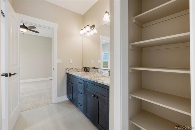 bathroom featuring vanity, tile patterned floors, and ceiling fan