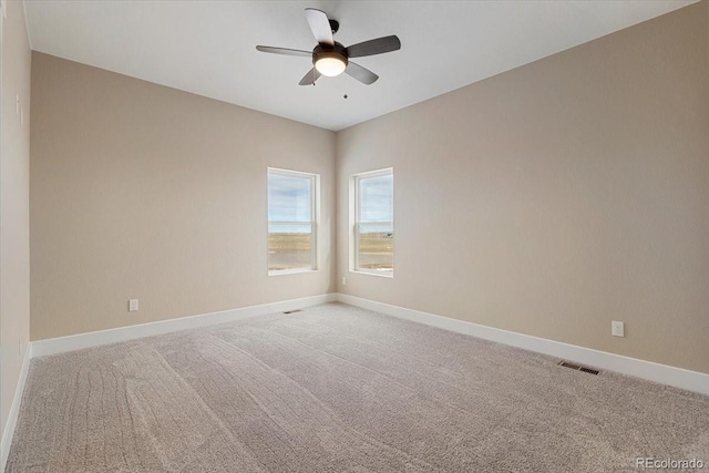 carpeted empty room with ceiling fan