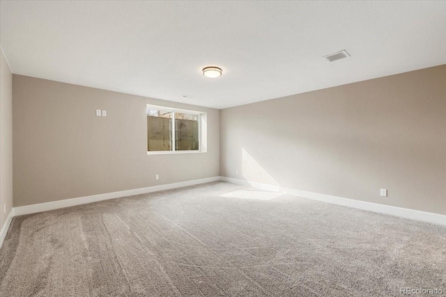 empty room featuring carpet flooring