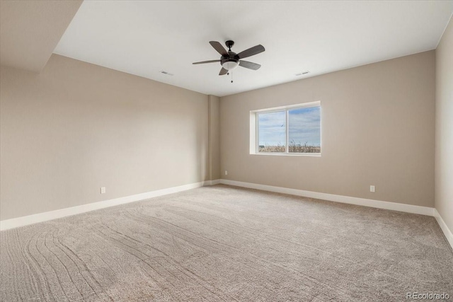 empty room with carpet floors and ceiling fan