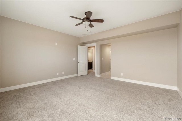 empty room with light carpet and ceiling fan