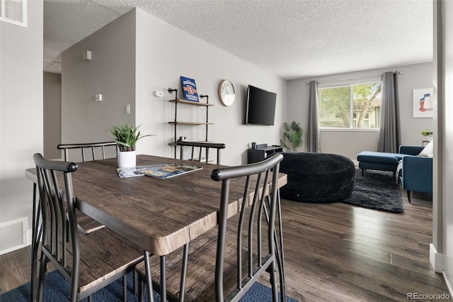 2271 Coronado Pkwy N Unit D, Denver, CO 80229 - dining room featuring wood finished floors and a textured ceiling