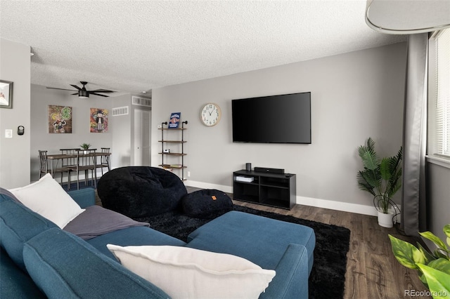 2271 Coronado Pkwy N Unit D, Denver, CO 80229 - living area featuring wood finished floors, a textured ceiling, a ceiling fan, and baseboards