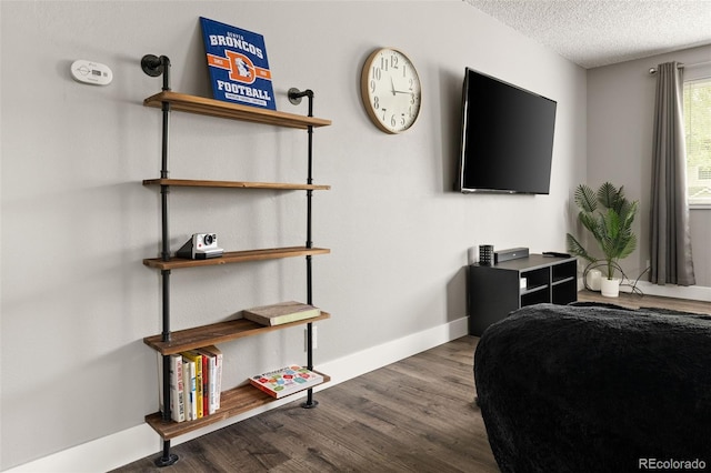 2271 Coronado Pkwy N Unit D, Denver, CO 80229 - bedroom with a textured ceiling, wood finished floors, and baseboards