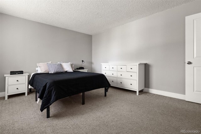 2271 Coronado Pkwy N Unit D, Denver, CO 80229 - bedroom with light colored carpet, a textured ceiling, and baseboards