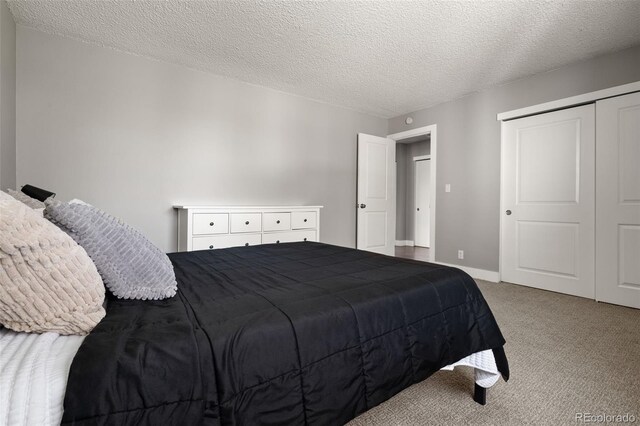 2271 Coronado Pkwy N Unit D, Denver, CO 80229 - carpeted bedroom with a closet and a textured ceiling