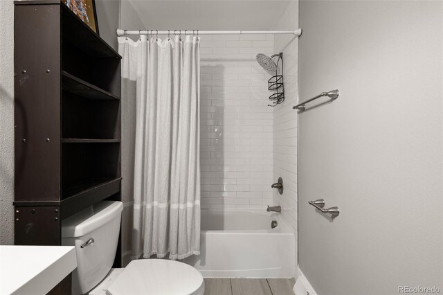 2271 Coronado Pkwy N Unit D, Denver, CO 80229 - bathroom featuring toilet, vanity, and shower / bathtub combination with curtain