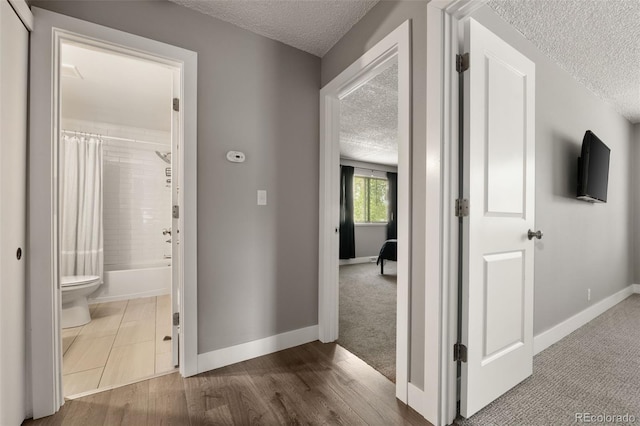 2271 Coronado Pkwy N Unit D, Denver, CO 80229 - hall with a textured ceiling and baseboards