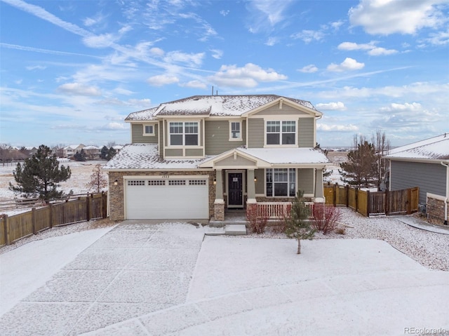 view of front of property featuring a garage and covered porch