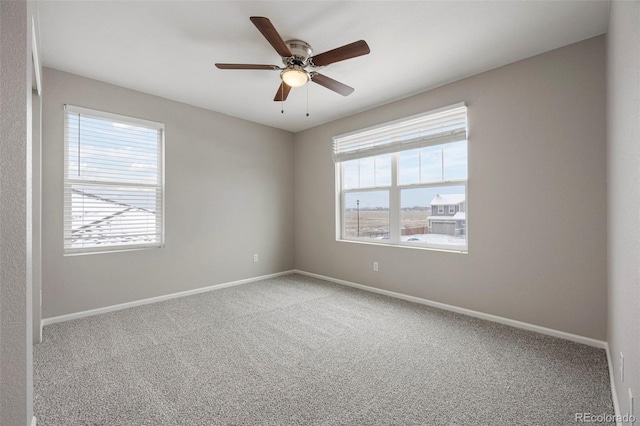 1523 Honeysuckle Ct, Brighton, CO 80601 - empty room featuring carpet floors, baseboards, and ceiling fan