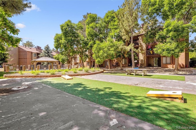 view of community with a yard and a gazebo