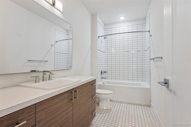 full bathroom featuring toilet, bathtub / shower combination, baseboards, and vanity