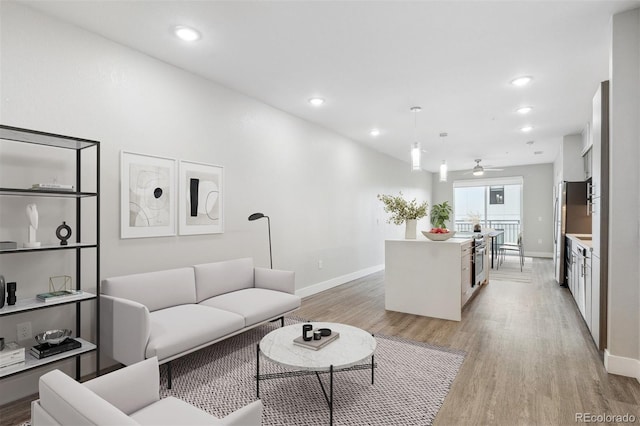 3500 S Corona St Unit 409, Englewood, CO 80113 - living area featuring ceiling fan, baseboards, light wood-type flooring, and recessed lighting