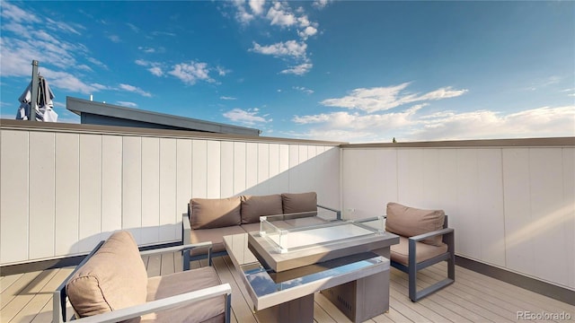 view of patio / terrace featuring an outdoor living space and a wooden deck