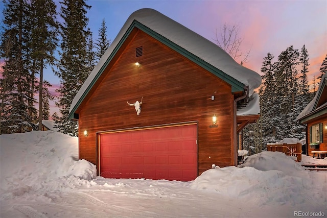 view of snow covered garage