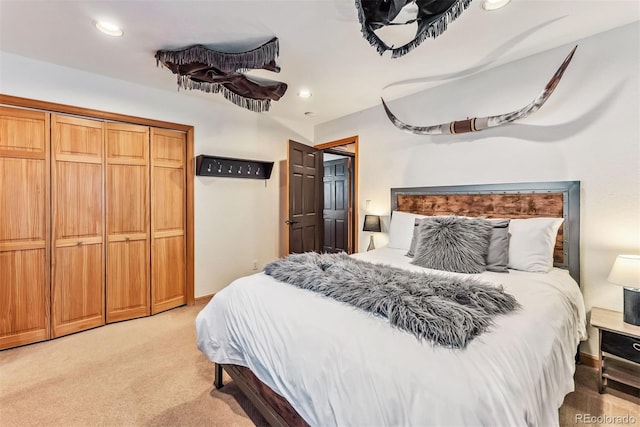 bedroom with light carpet and recessed lighting