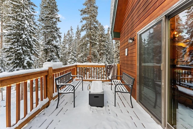 view of snow covered deck